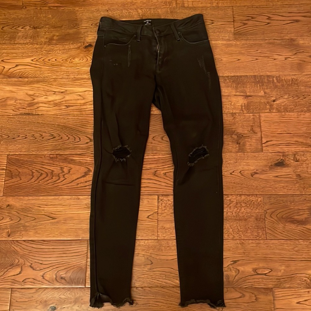 Black skinny jeans with rips in knees